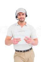 Delivery man with headset and clipboard