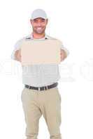 Portrait of happy delivery man giving package
