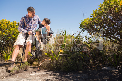 Father and son hiking in the mountains