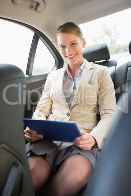 Businesswoman working on her tablet computer