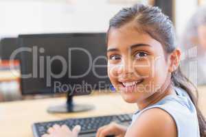 Cute pupil in computer class