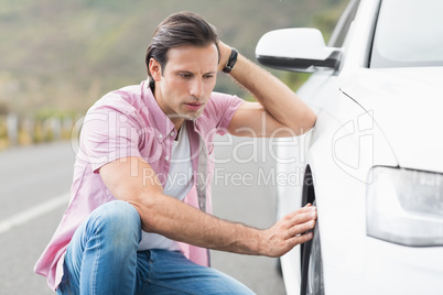 Stressed man looking at wheel