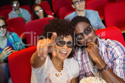 Young couple watching a 3d film