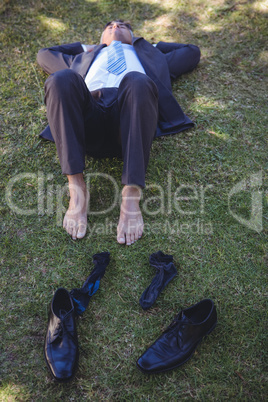 Businessman relaxing in the park