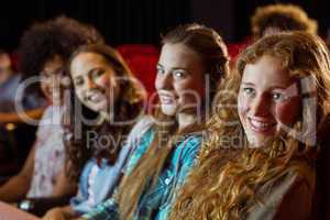 Young friends watching a film