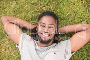 Handsome hipster relaxing in the park