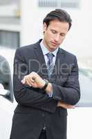 Businessman checking time
