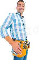 Portrait of smiling handyman wearing tool belt