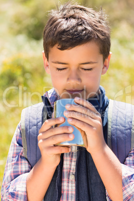 Little boy hiking in the mountains