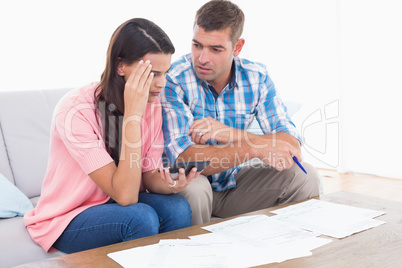 Couple calculating home finances together