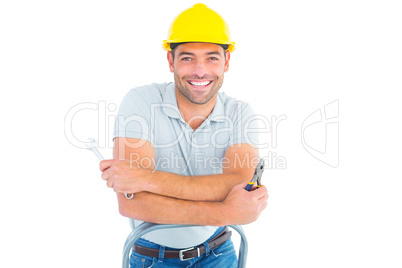 Repairman with hand tools on step ladder
