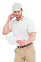Delivery man talking on mobile phone