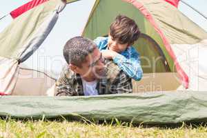 Father and son in their tent