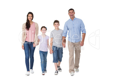 Portrait of happy family walking over white background