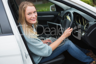 Young woman working in the drivers seat