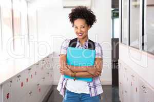 Casual young woman with folder in office