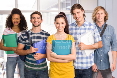 Students holding folders in college