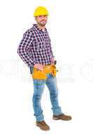 Confident handyman standing with hands on hips