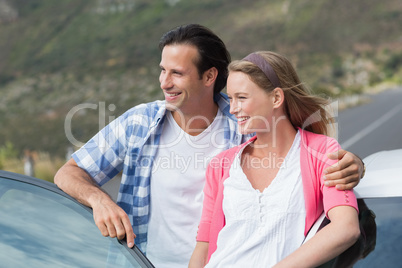 smiling couple looking away smiling couple looking away