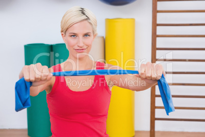Blonde woman stretching arms