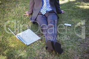 Businessman working in the park