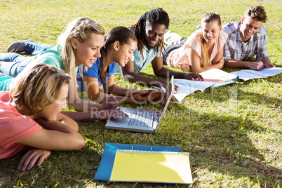 Students studying outside on campus