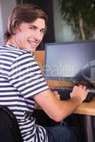 Student using computer in classroom