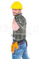 Confident manual worker gesturing thumb up