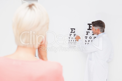 Blonde woman doing eye exam