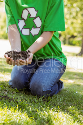 Environmental activist about to plant tree