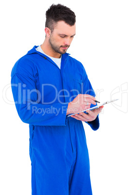 Mechanic writing on clipboard Mechanic writing on clipboard