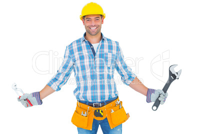 Portrait of handyman holding hand tools