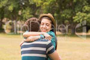 Young couple hugging in the park