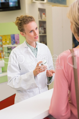 Pharmacist and her customer talking about medication