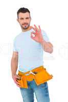 Smiling handyman gesturing okay