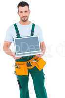 Happy construction worker holding laptop