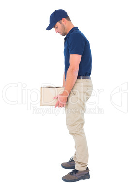 Delivery man carrying heavy package on white background