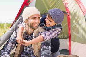 Father and son in their tent