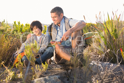 Father and son hiking in the mountains