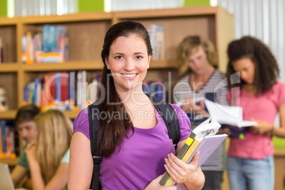 College students doing homework in library