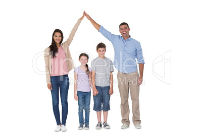 Happy parents joining hands above children