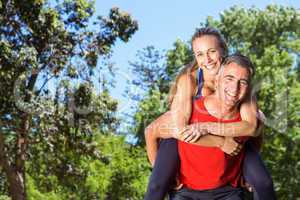 Fit couple having fun in the park