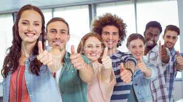 Fashion students showing thumbs up