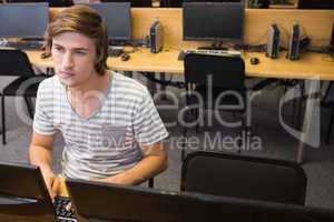 Student working on computer in classroom