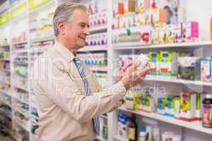 Smiling customer looking at medicine