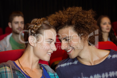 Young couple watching a film