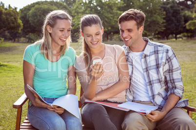 Students studying outside on campus