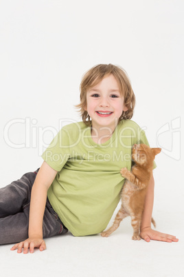 Portrait of happy boy with kitten