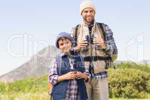 Father and son hiking in the mountains