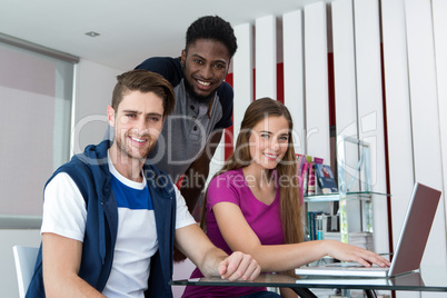 Creative team using laptop